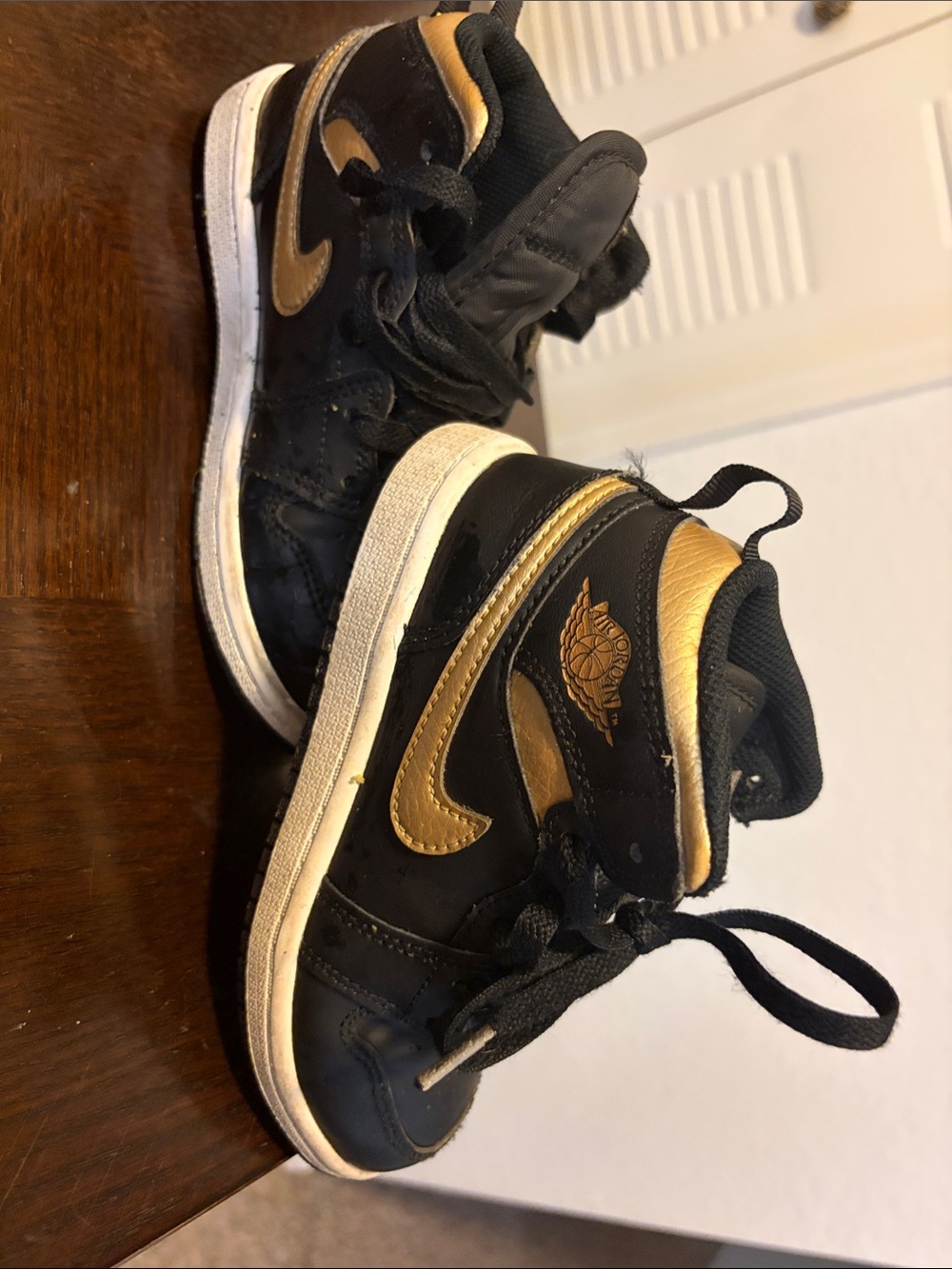 Jordan Kids Black and Gold High-Top Sneakers